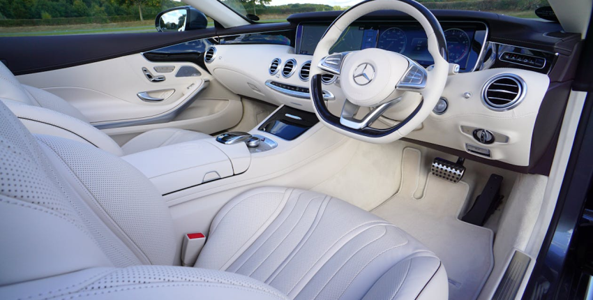 Luxury car interior with dashboard and steering wheel